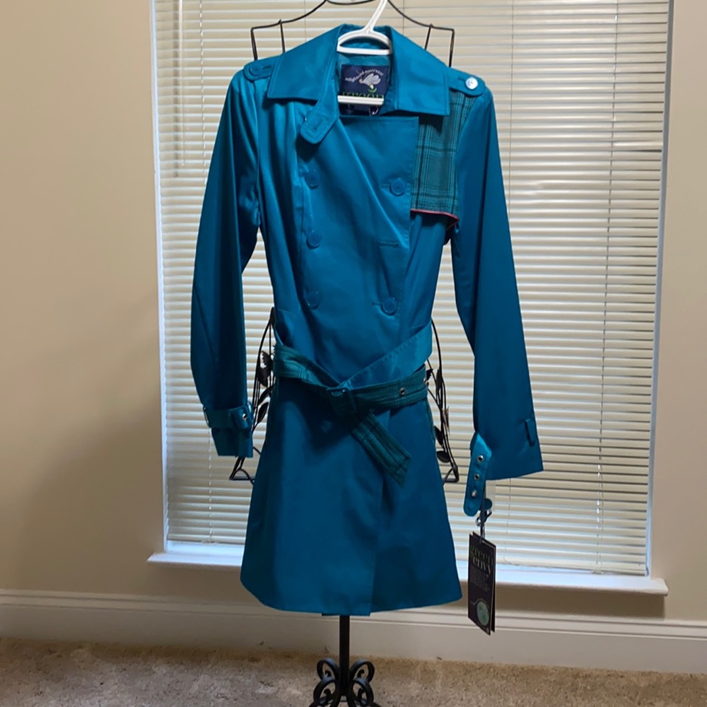 Stylish Green with Envy turquoise trench coat.